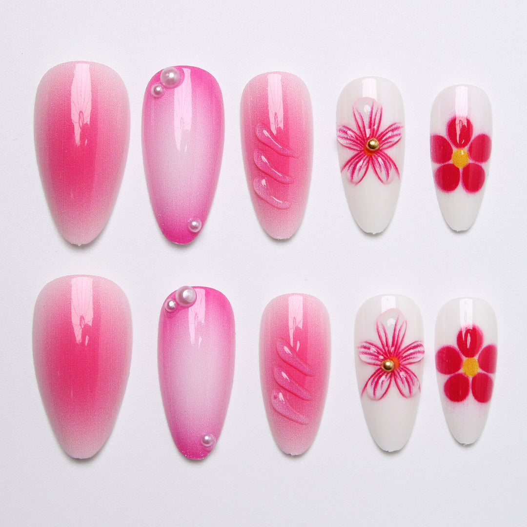 Artificial nail set with delicate flower designs and shimmering accents Bowlift