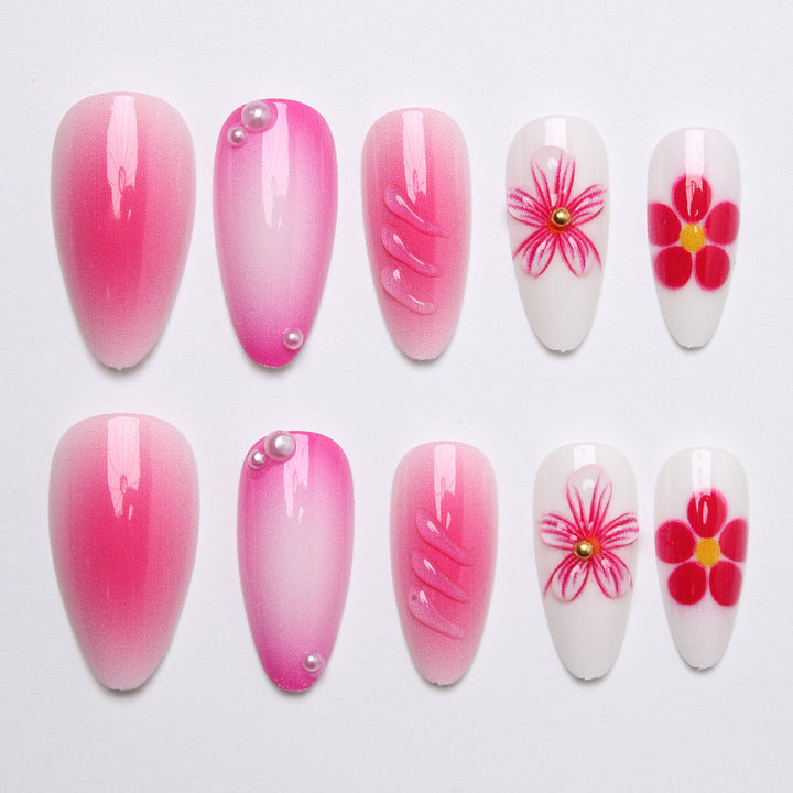 Artificial nail set with delicate flower designs and shimmering accents Bowlift