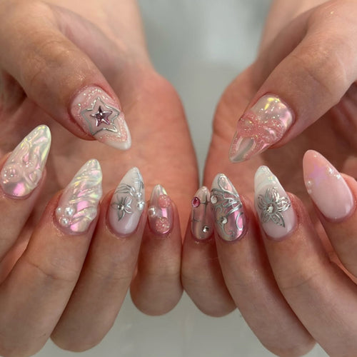 Artistic nail extensions with shiny embellishments Bowlift