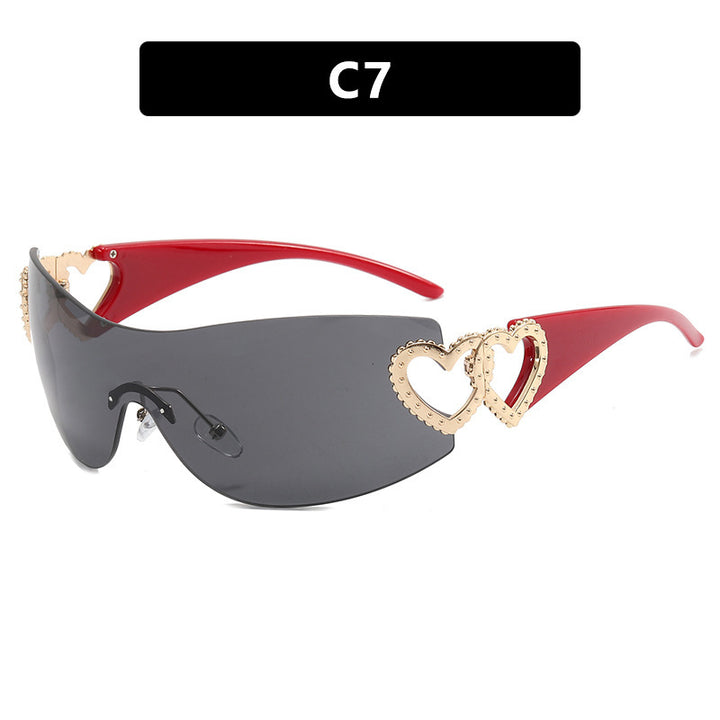 Ladies sporty sunglasses in trendy shield design with heart accents Bowlift