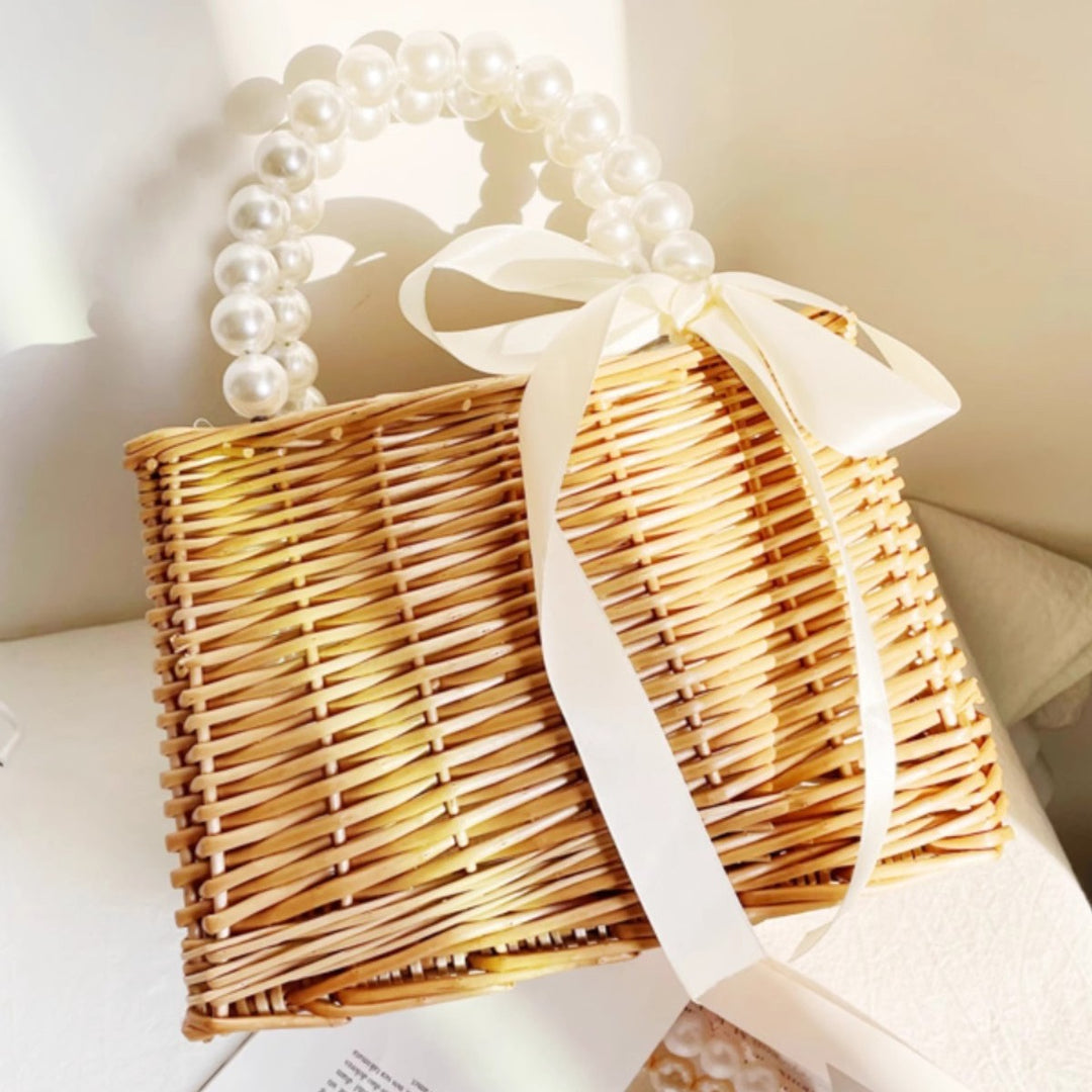 Ladies handbag made of braided material with elegant pearl handles Bowlift