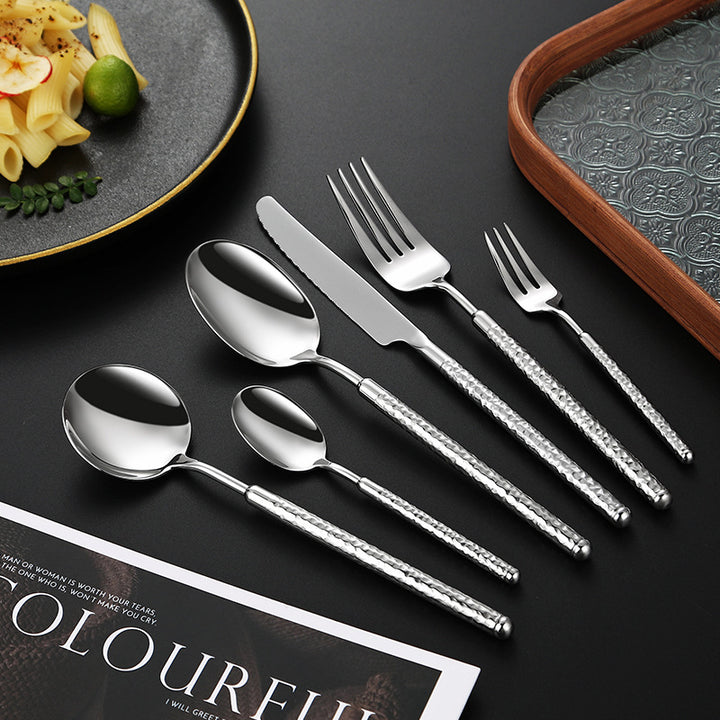 Elegant dessert spoon with elaborate handle design Bowlift