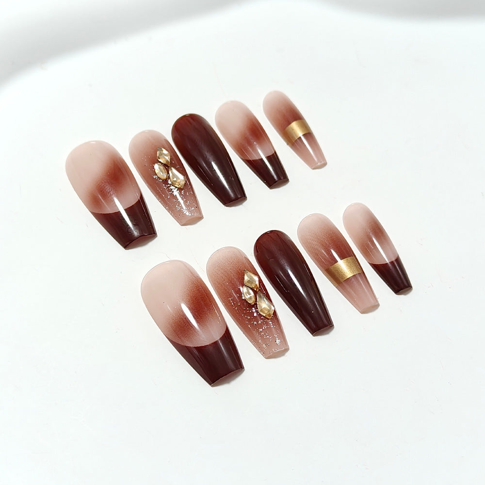 Luxurious artificial nails with glamorous decorations Bowlift