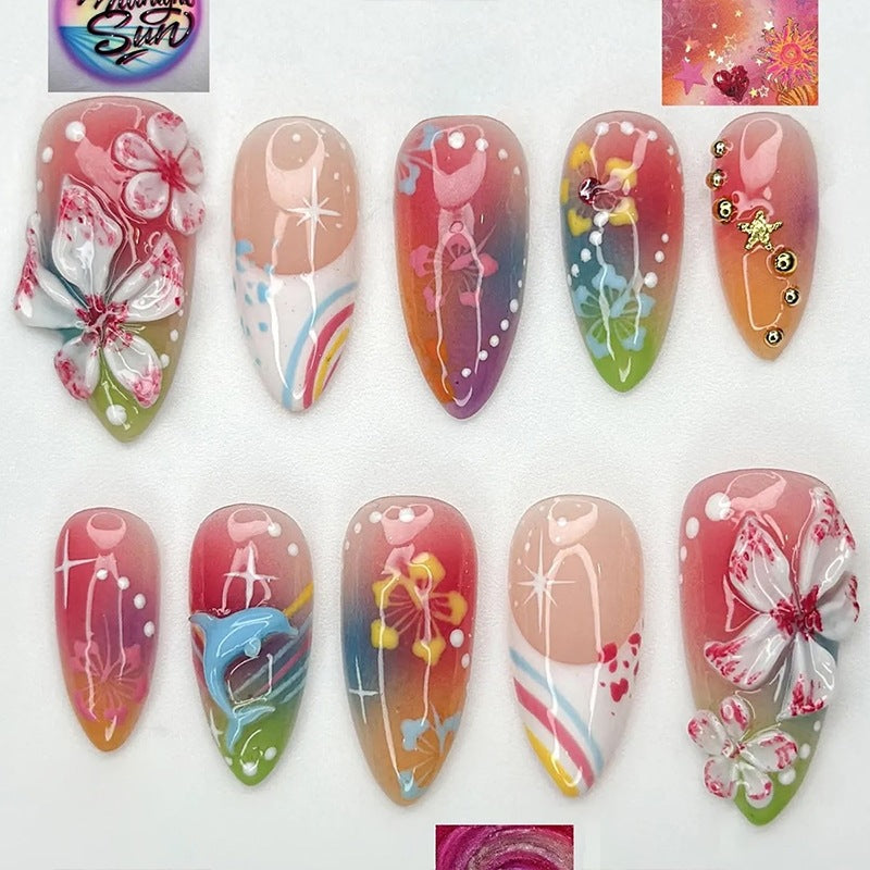 Artificial nail set with various designs and shiny embellishments Bowlift