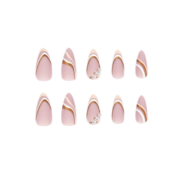 Artful stiletto nails with elegant gold and white accents Bowlift