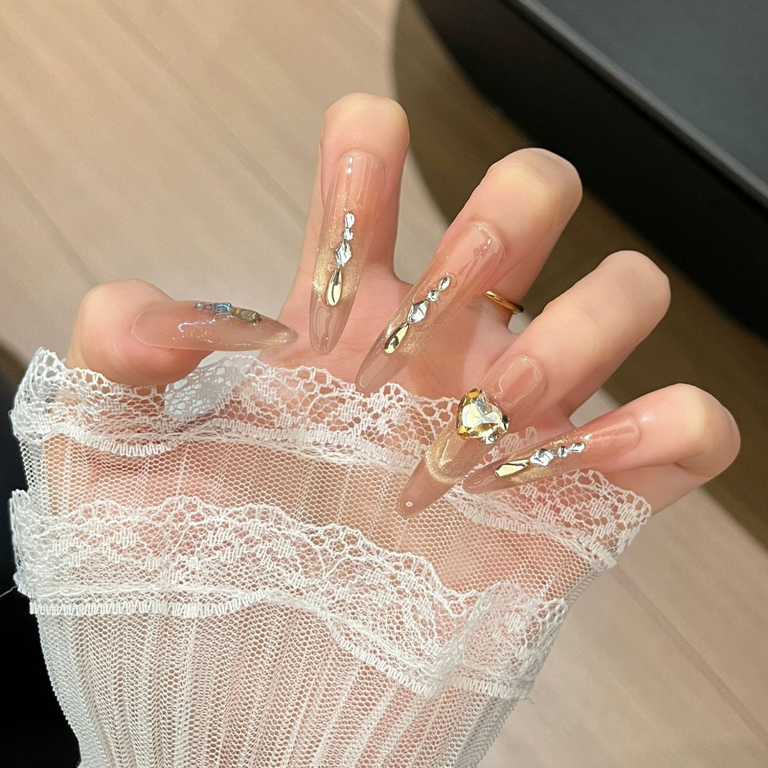 Artistic Stiletto Press-On Nail Art with Glimmering Accents Bowlift