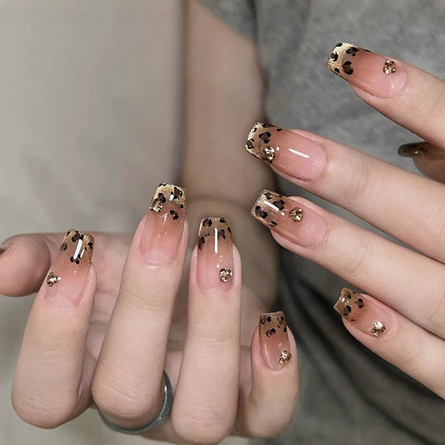 Elegant artificial nails with sparkling gold accents Bowlift
