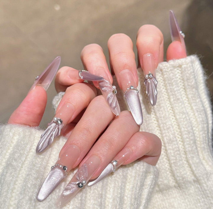 Artistic Stiletto Press-On Nail Art with Glimmering Accents Bowlift