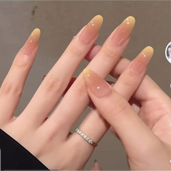 Artificial nails with elegant ombre effect and glitter coating Bowlift