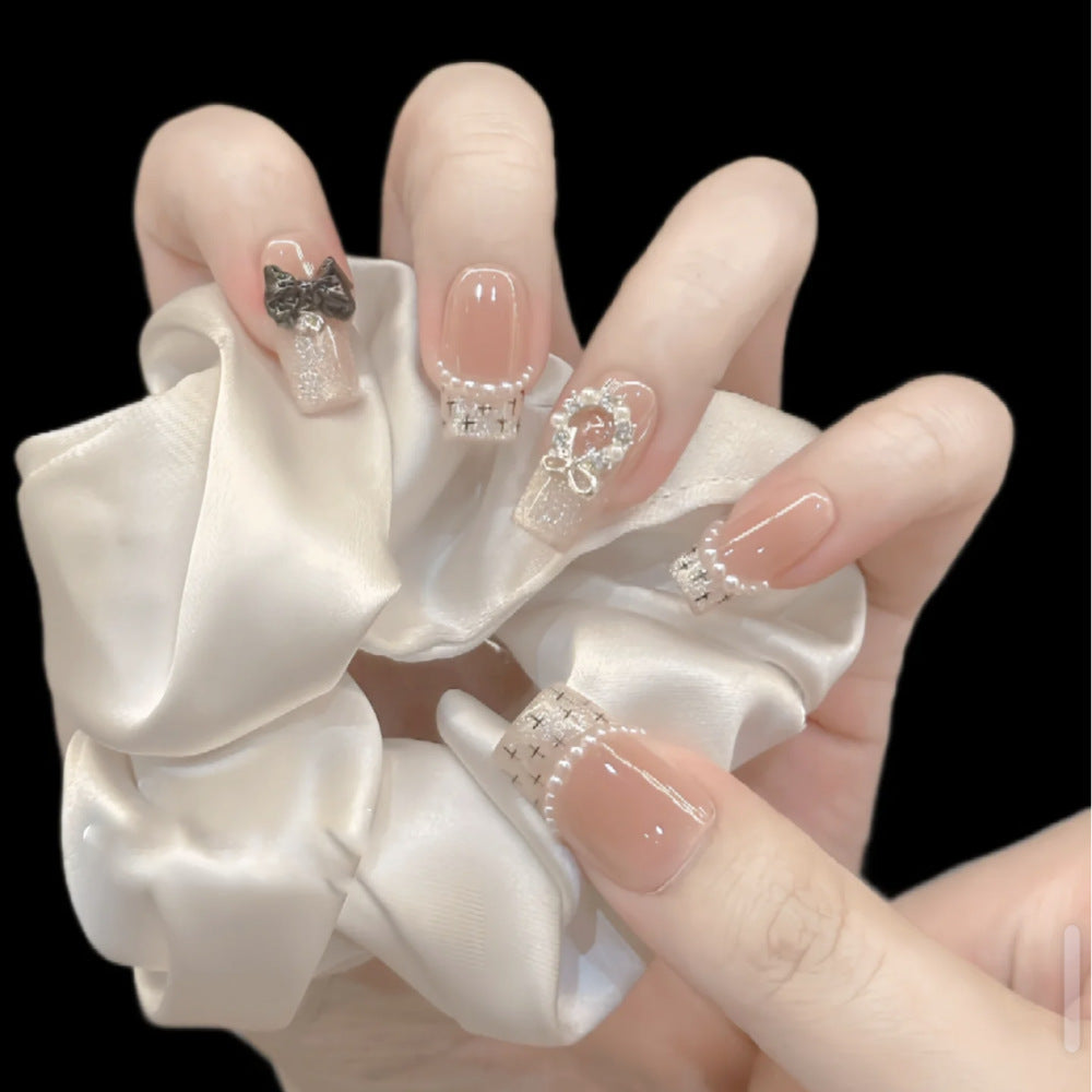 Glamorous artificial nails with sparkling decorations Bowlift