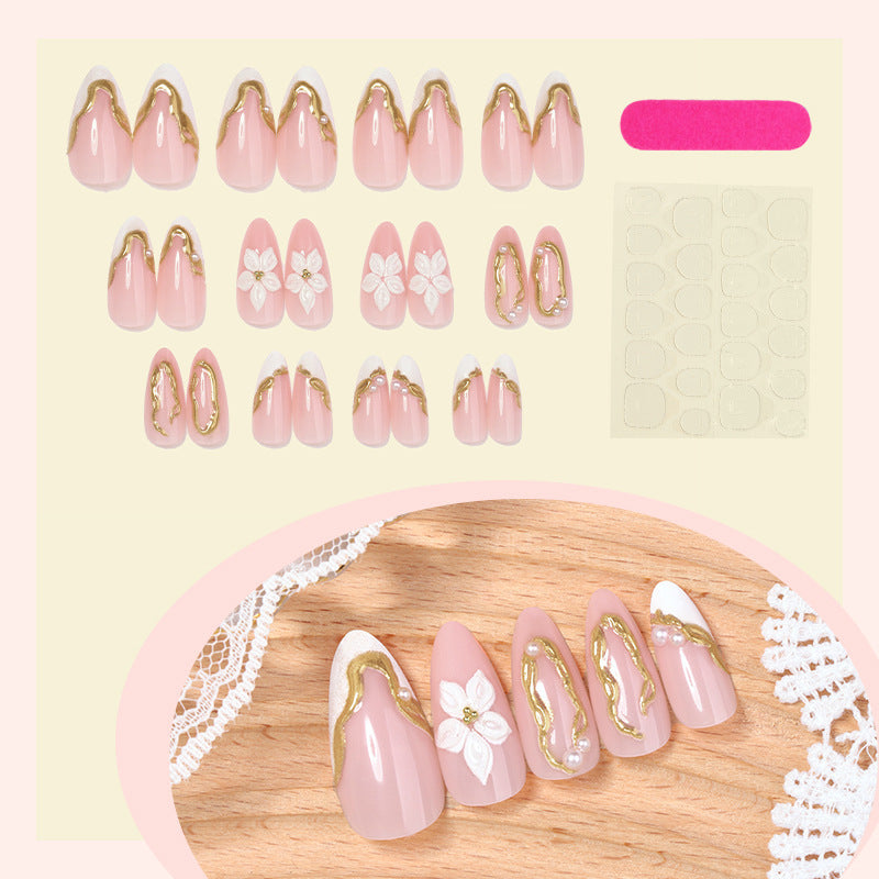 Artificial nail set with elegant gold accents and floral decorations Bowlift