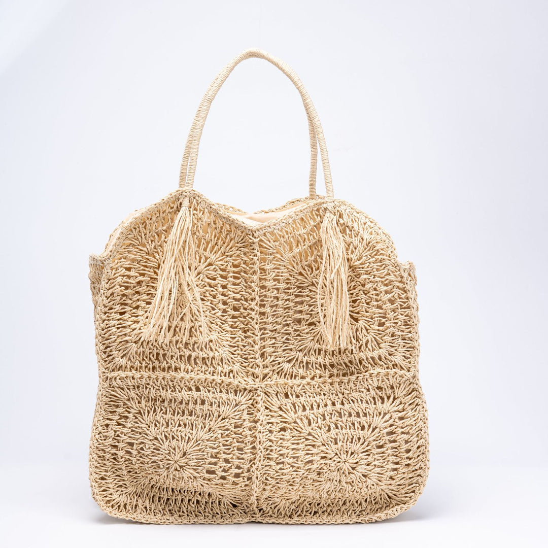 Handcrafted straw beach bag with decorative fringes Bowlift