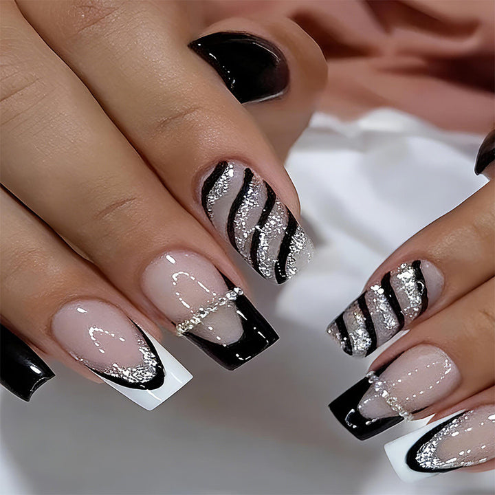 Elegant artificial nails with glitter and stripe accents Bowlift