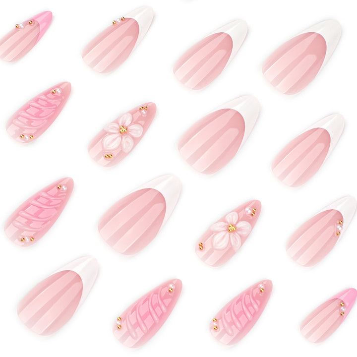 Artificial nail art with floral design and glitter accents Bowlift