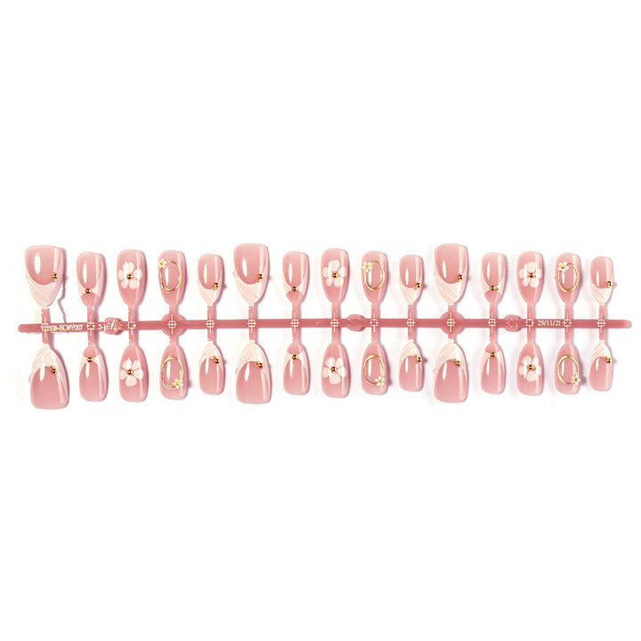 Artificial nail set with elegant flower and glitter accents Bowlift