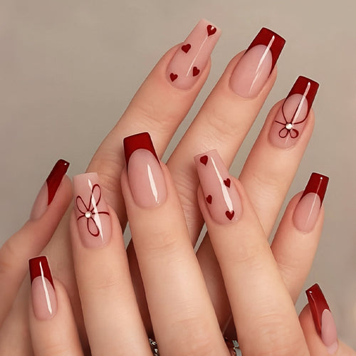 Artificial nail set with romantic hearts and elegant bows Bowlift