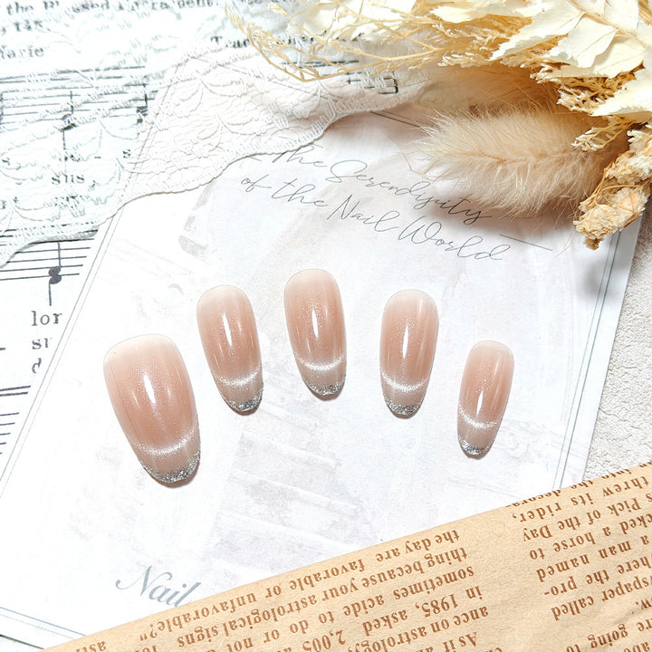 Artificial nails with elegant gloss and glitter accents Bowlift