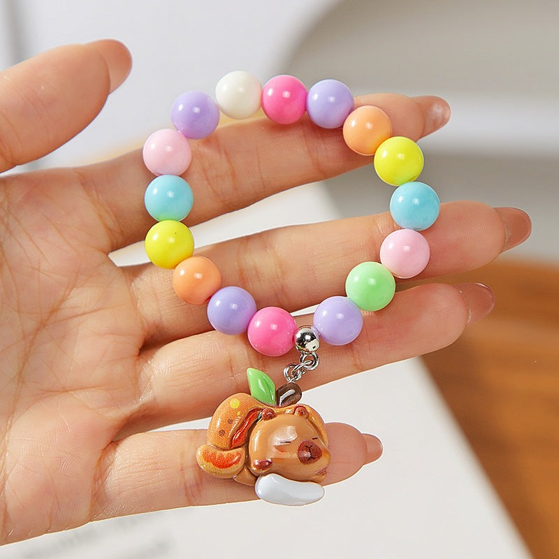 Colorful children's bracelet with crafted pendant Bowlift