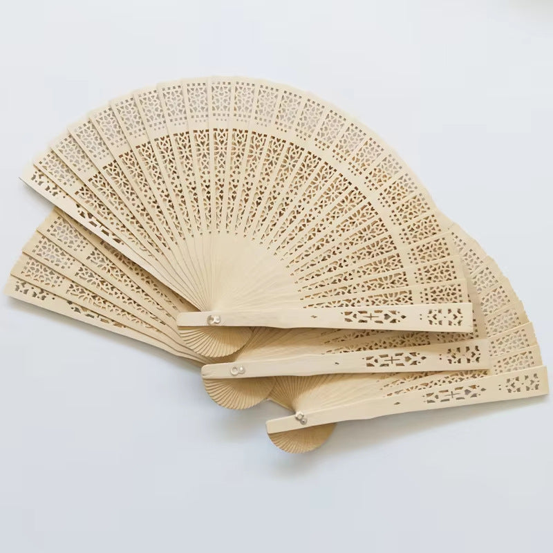 Ladies fan made of delicate plastic with artistic cut pattern Bowlift