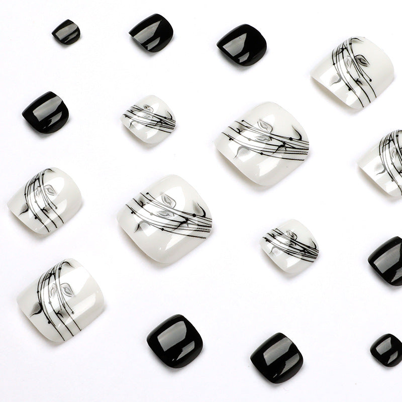 Artful toenail art in elegant black and white design Bowlift
