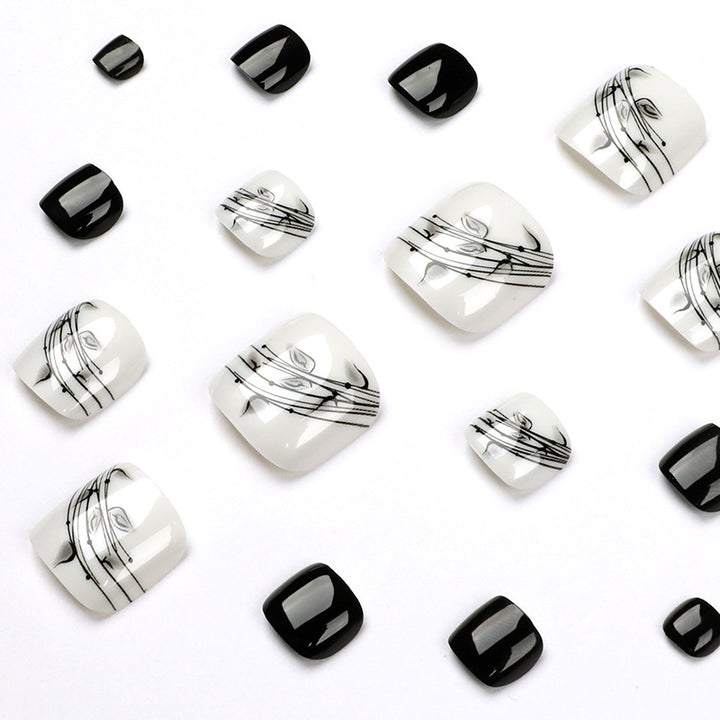 Artful toenail art in elegant black and white design Bowlift