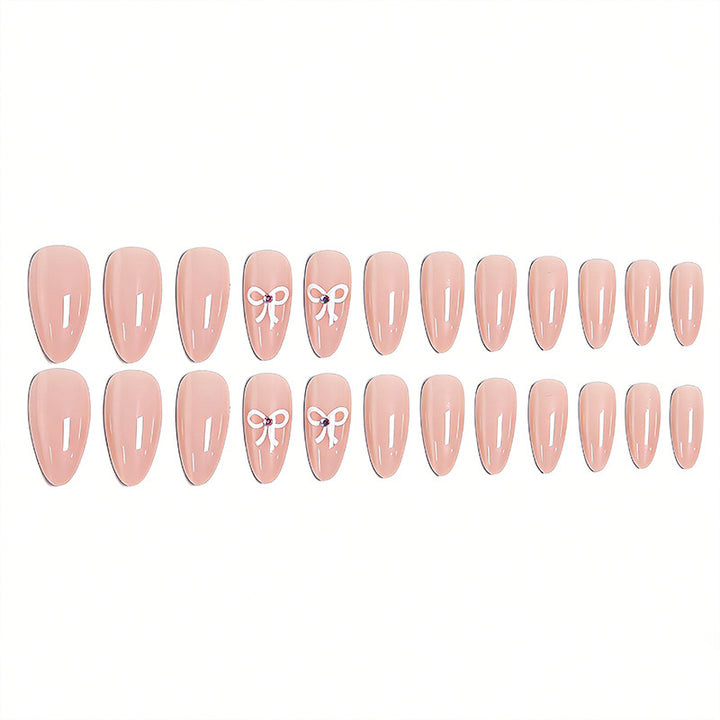 Artificia nails with delicate bow accents Bowlift