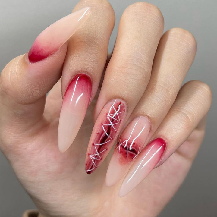 Creative Stiletto Nail Art with Blood Red Accents Bowlift