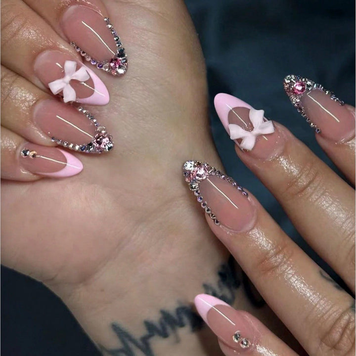 Acrylic nail set with elegant 3D bows and sparkling rhinestone embellishments Bowlift