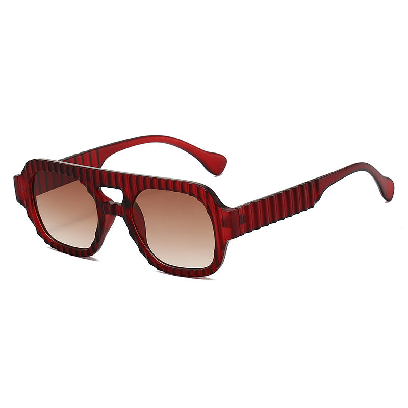 Ladies fashionable sunglasses in futuristic design with textured frame Bowlift