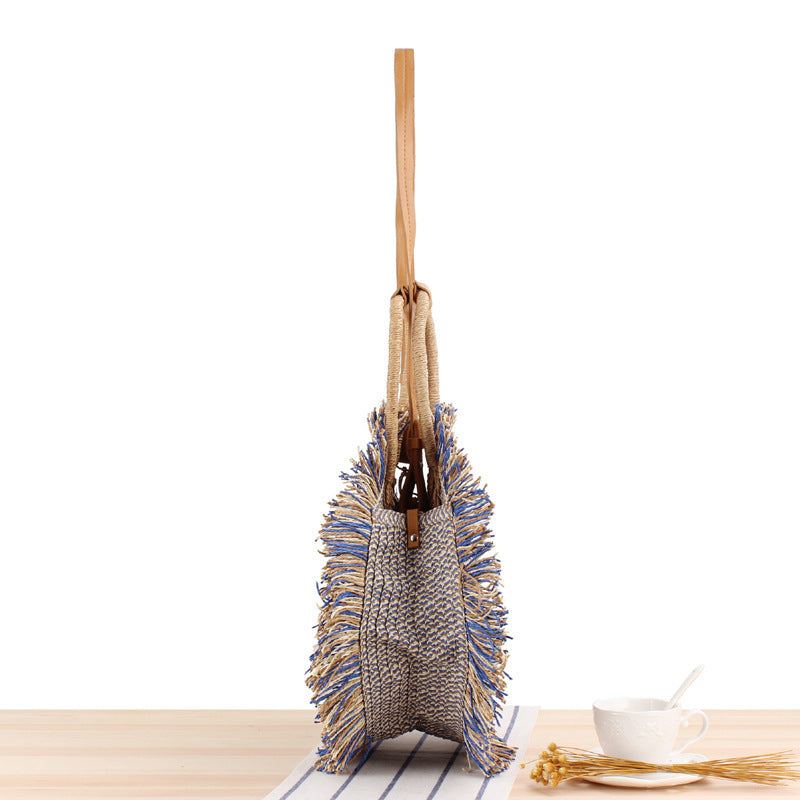 Round Bast shoulder bag with fringes and leather handles Bowlift