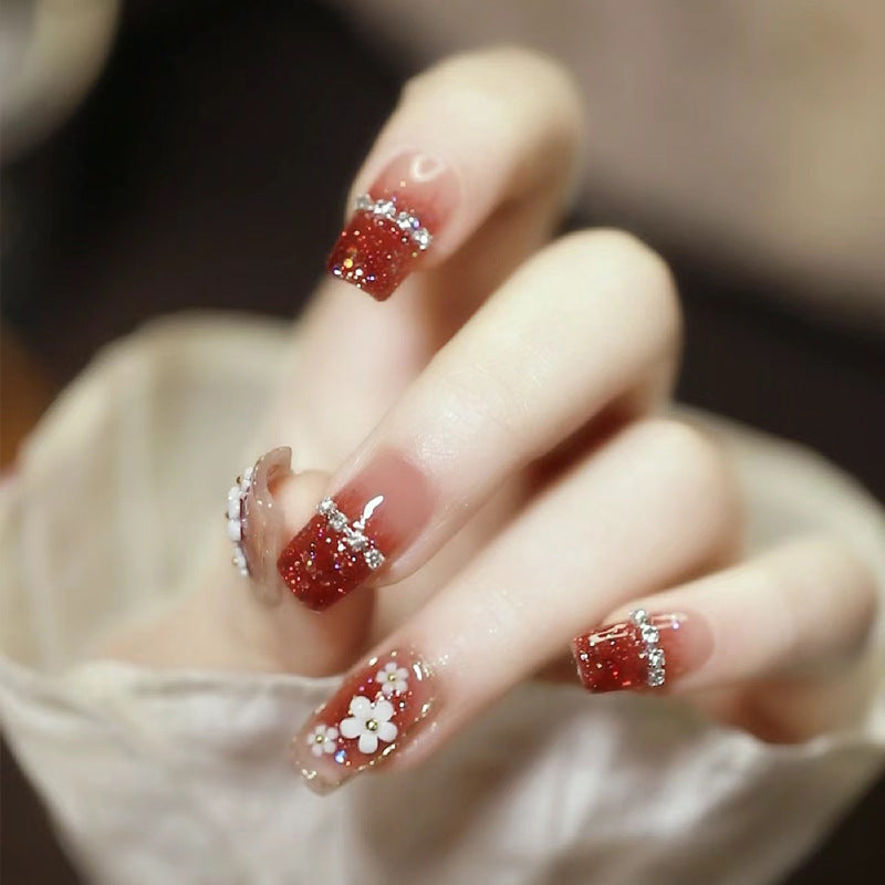 Artistic Press-On Nail Art with Floral and Glitter Accents Bowlift