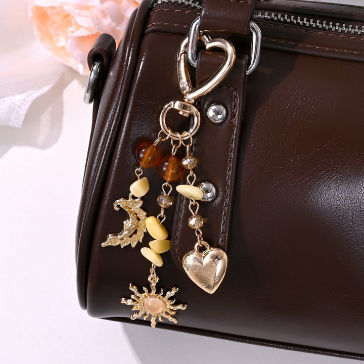 Keychain with Sparkling Sun Motif Bowlift