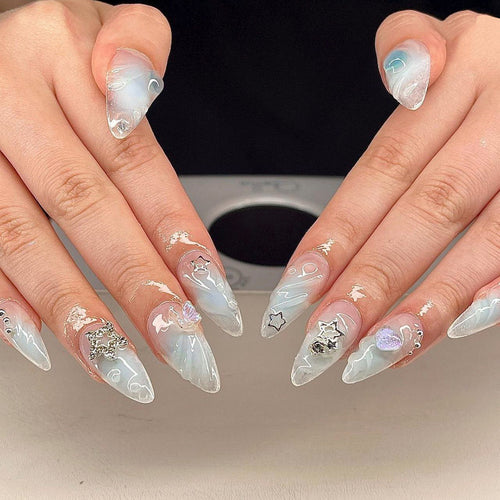 Artistic 3D Nail Extensions with Colorful Designs and Glitter Accents Bowlift