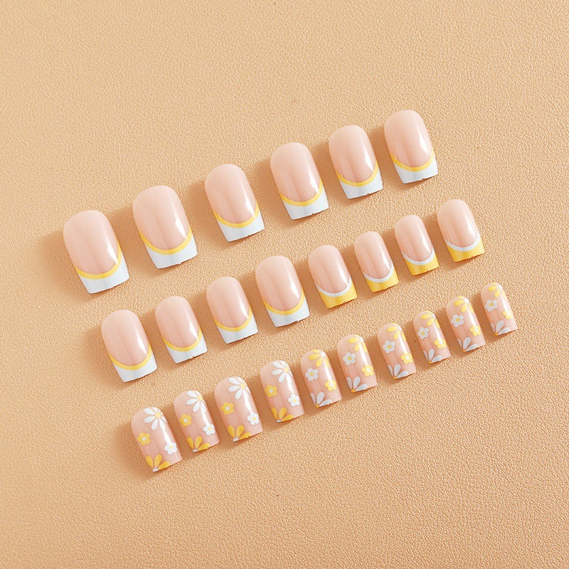 Nail art set with creative floral designs and elegant French finish Bowlift