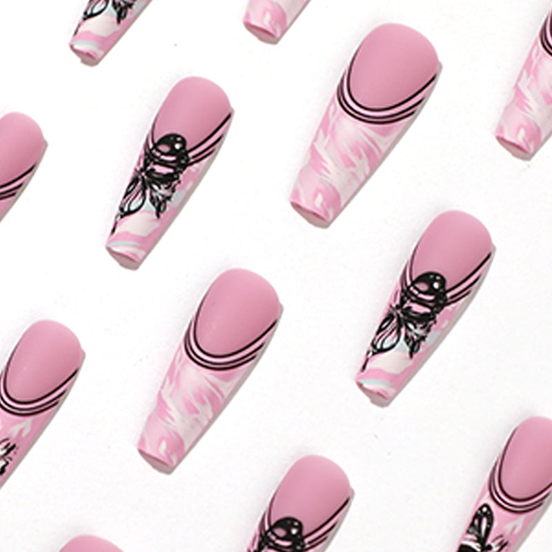 Artificial nail art with delicate butterfly designs Bowlift