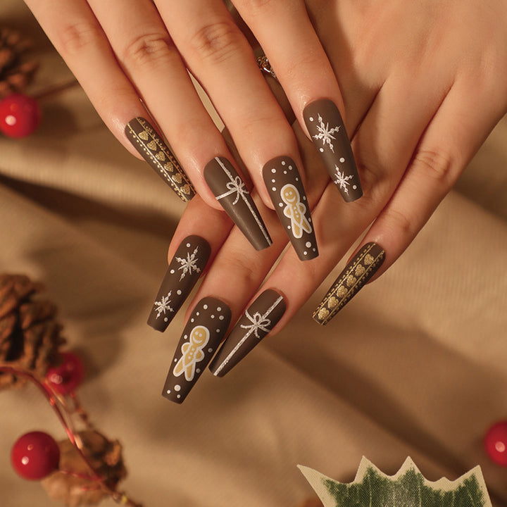 Artificial nail art with festive gingerbread design Bowlift