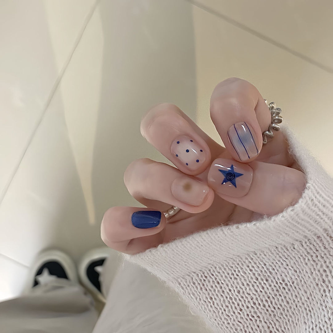 Artificial nails in modern design with geometric and sparkling accents Bowlift