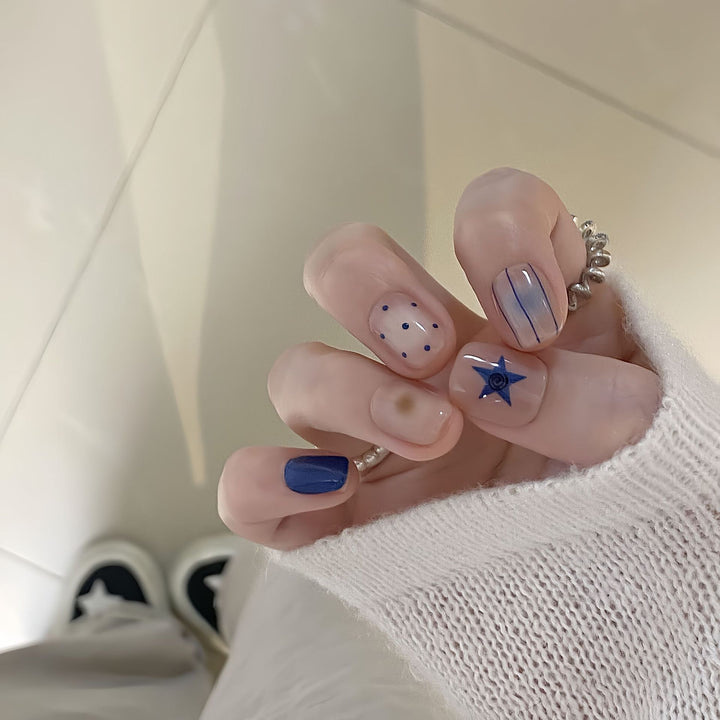 Artificial nails in modern design with geometric and sparkling accents Bowlift
