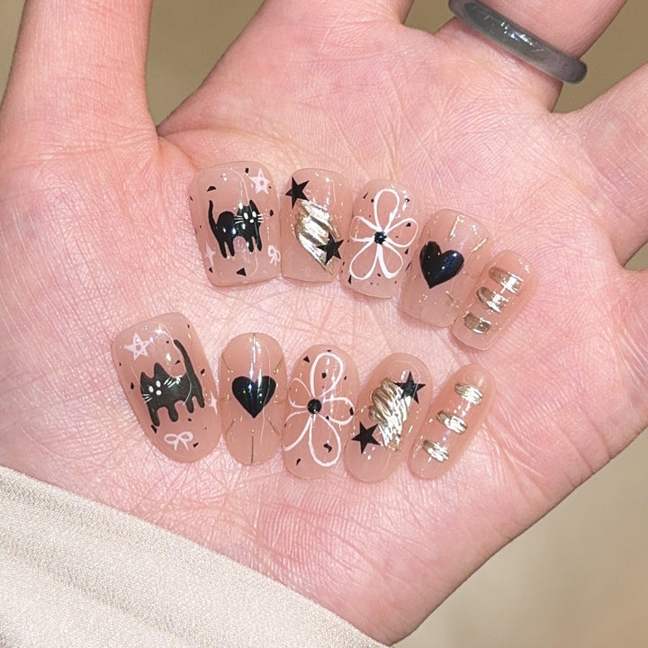 Artificial nails with unique cat and star design Bowlift