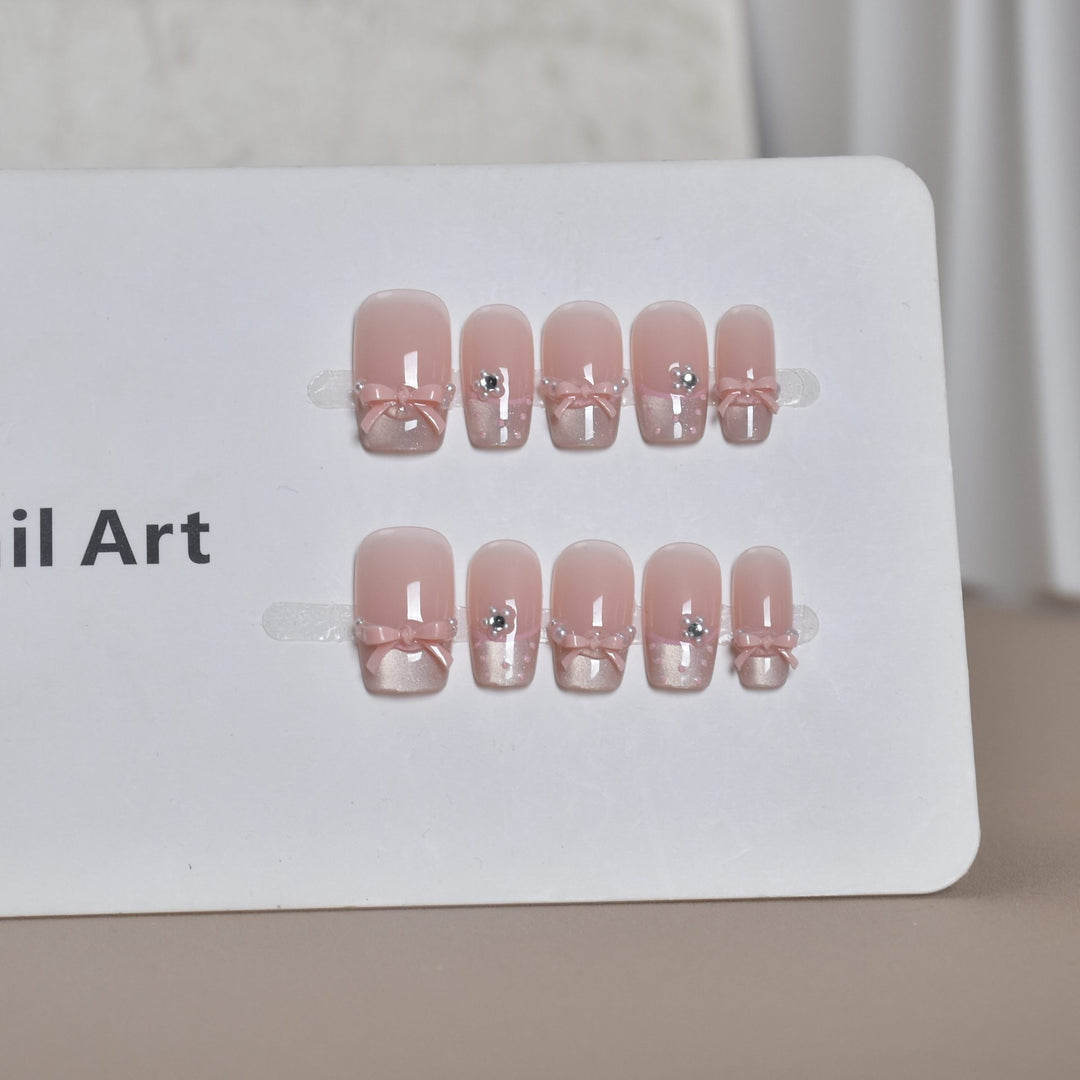 Elegant French Tip Press-On Nail Art with Bow Accents Bowlift