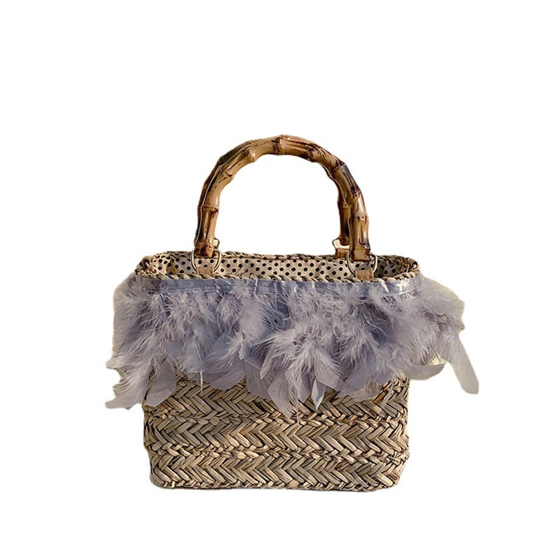 Elegant handbag with feathers and bamboo handles Bowlift