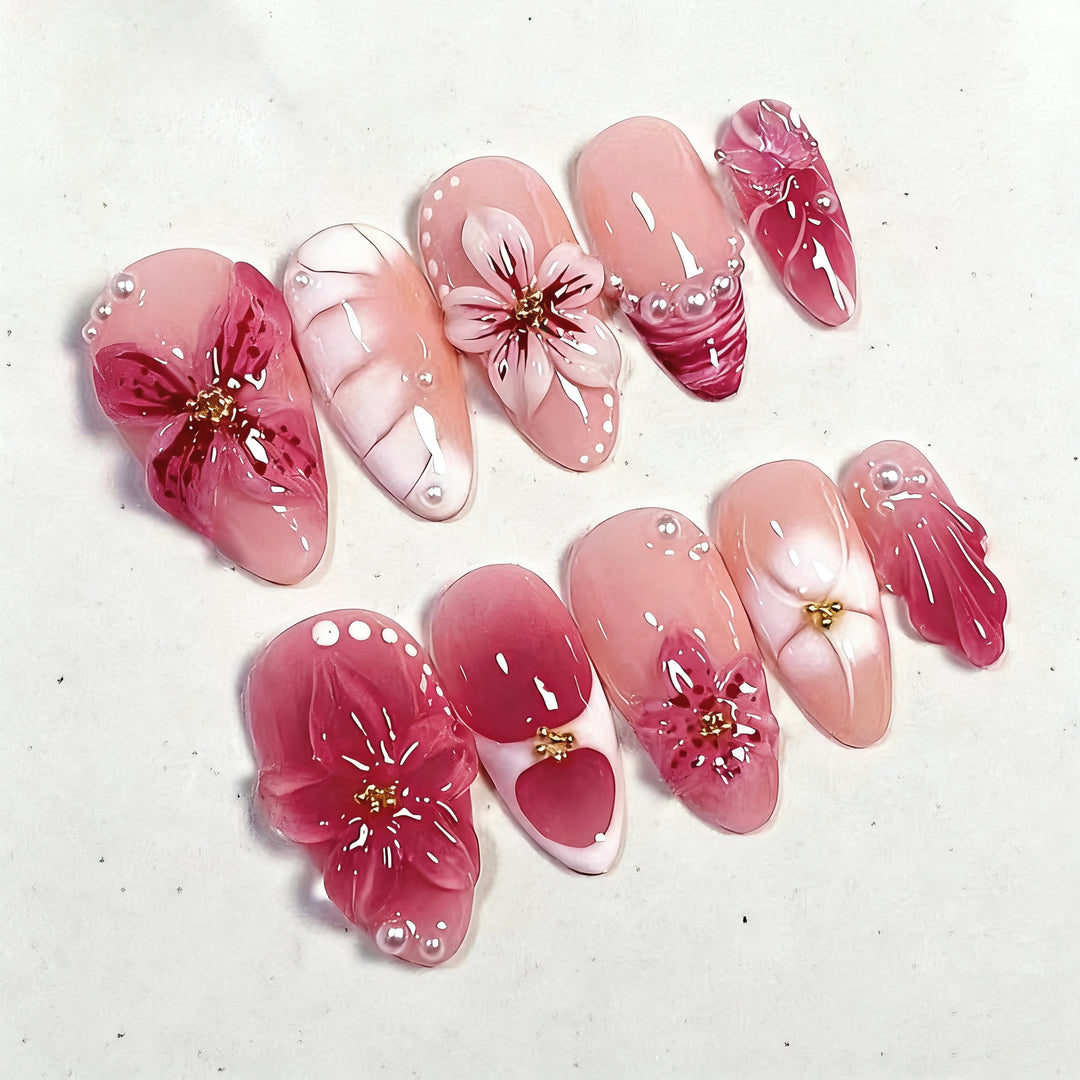 Artificial nail set with glamorous floral designs and creative glitter accents Bowlift