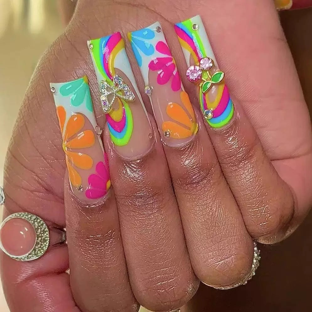 Artificial nails with colorful floral patterns and decorative accents Bowlift