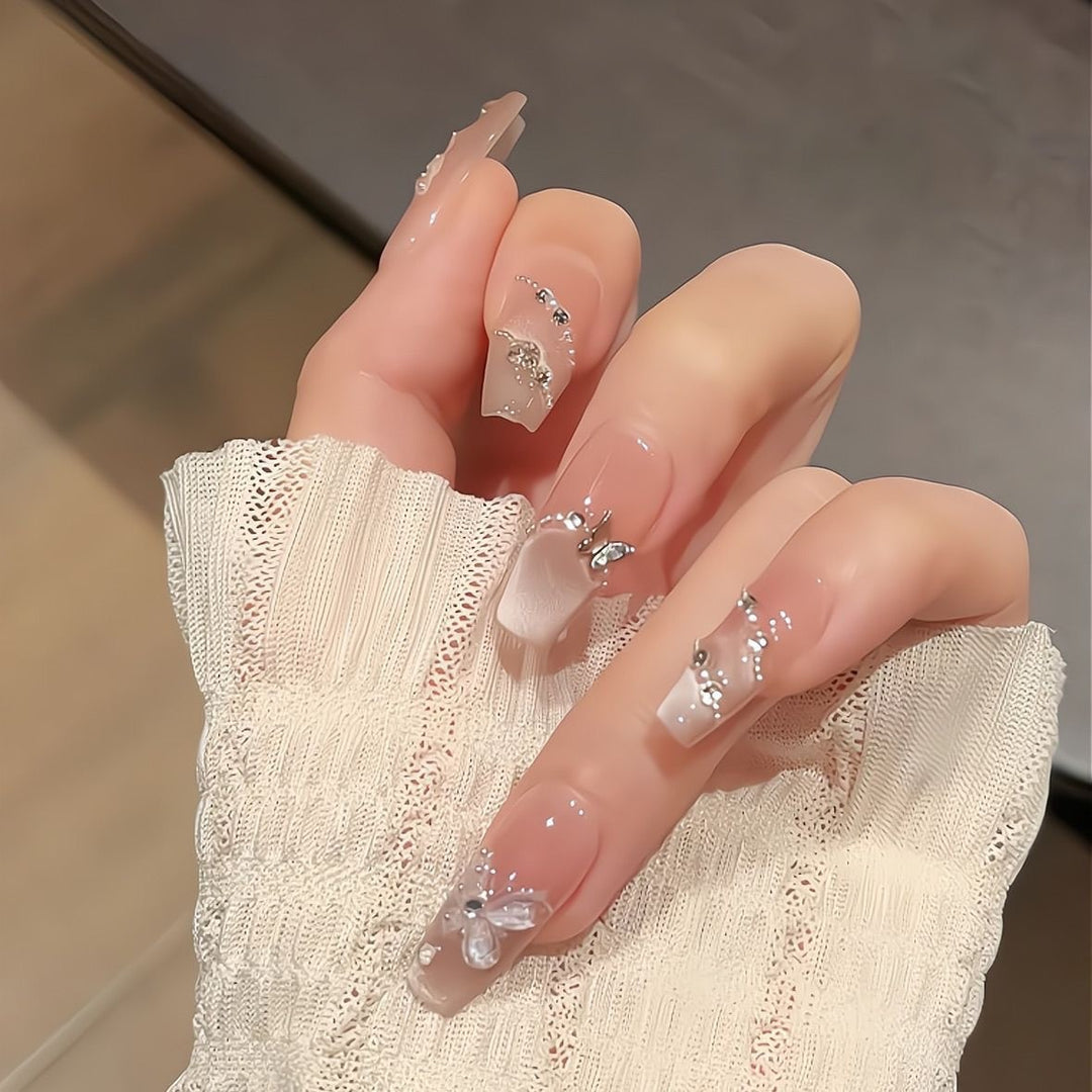 Artificial nails with glamorous decorations and shine Bowlift