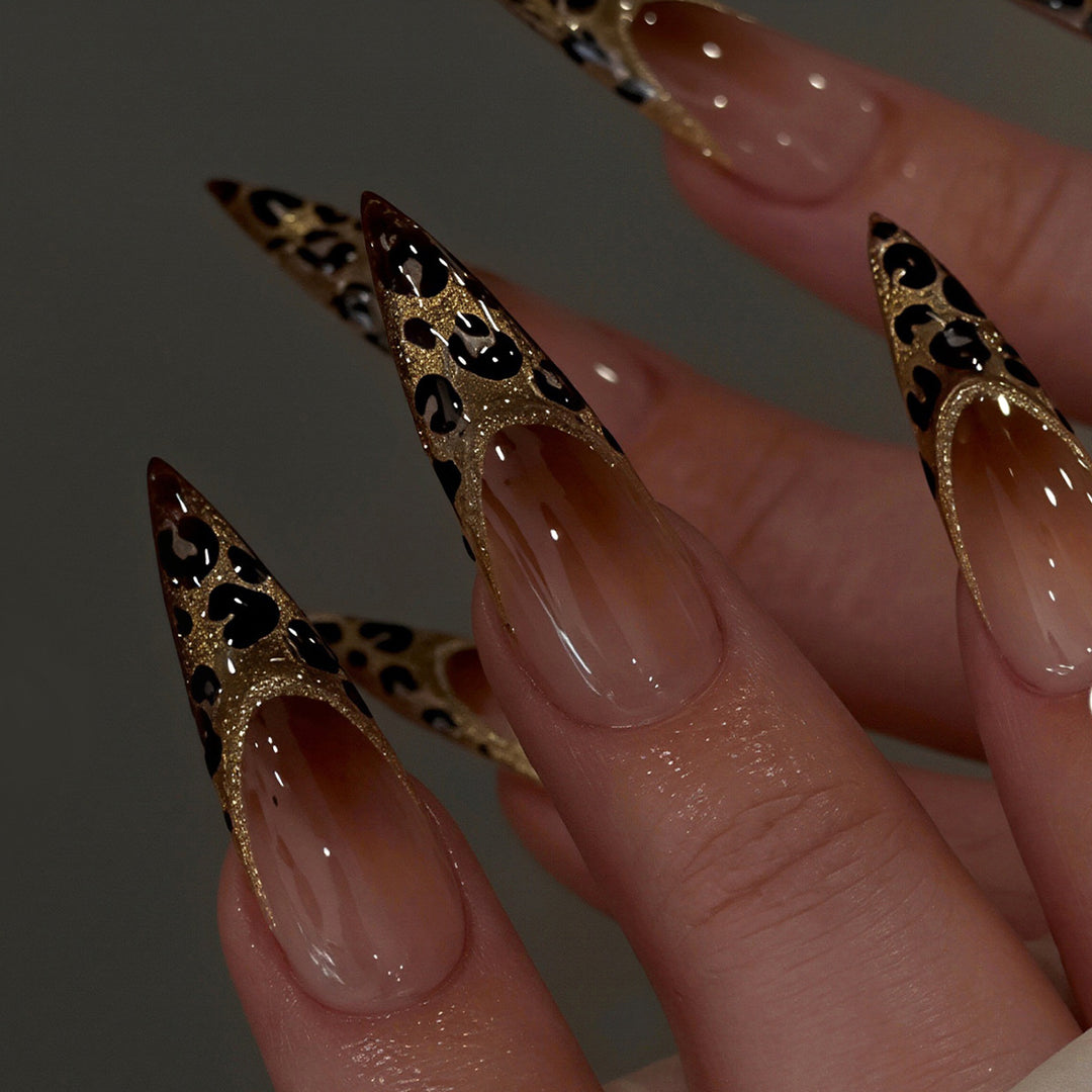 Elegant Stiletto Nail Art Set with Gold and Leopard Accents Bowlift