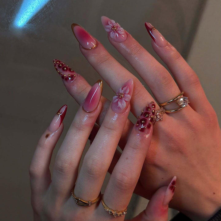 Artificial nails with floral and glitter accents Bowlift