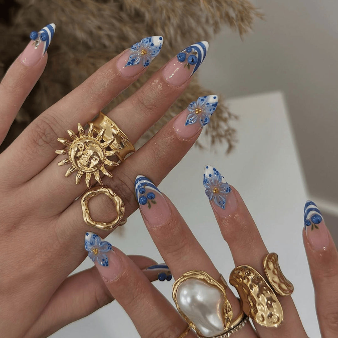 Artful nail design with floral and maritime elements Bowlift