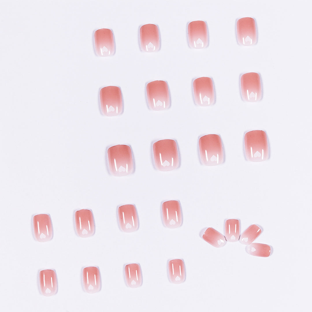 Artful nail art with heart-shaped accents and gentle ombre effect Bowlift