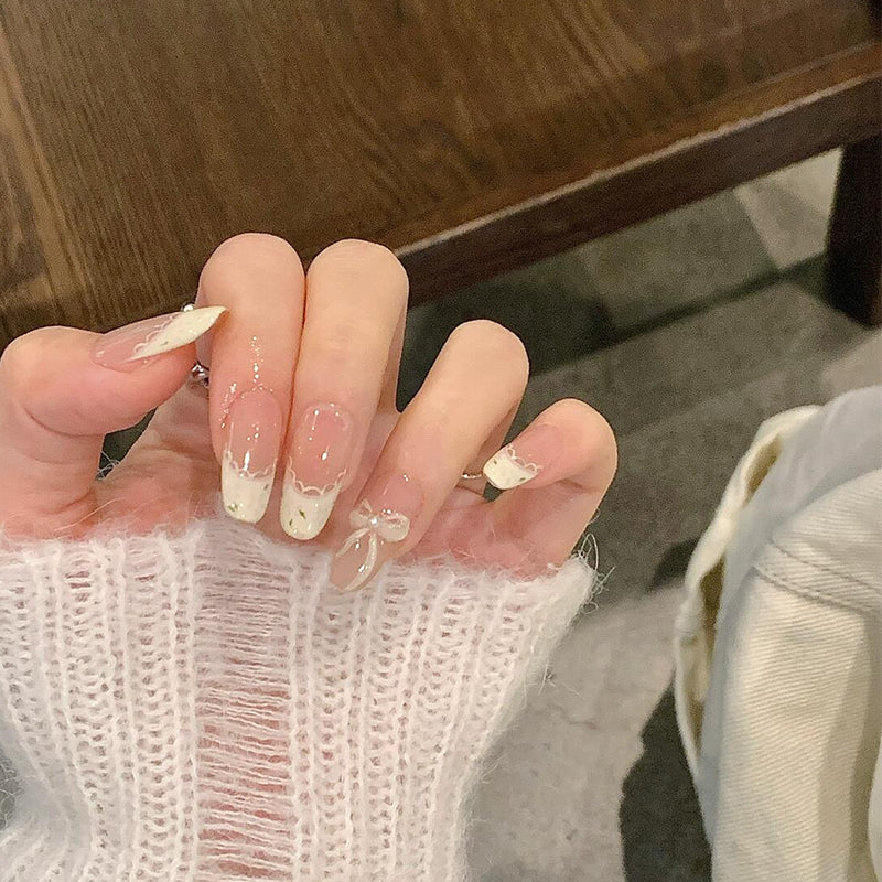 Artificial nails with elegant tip embellishment and romantic details Bowlift