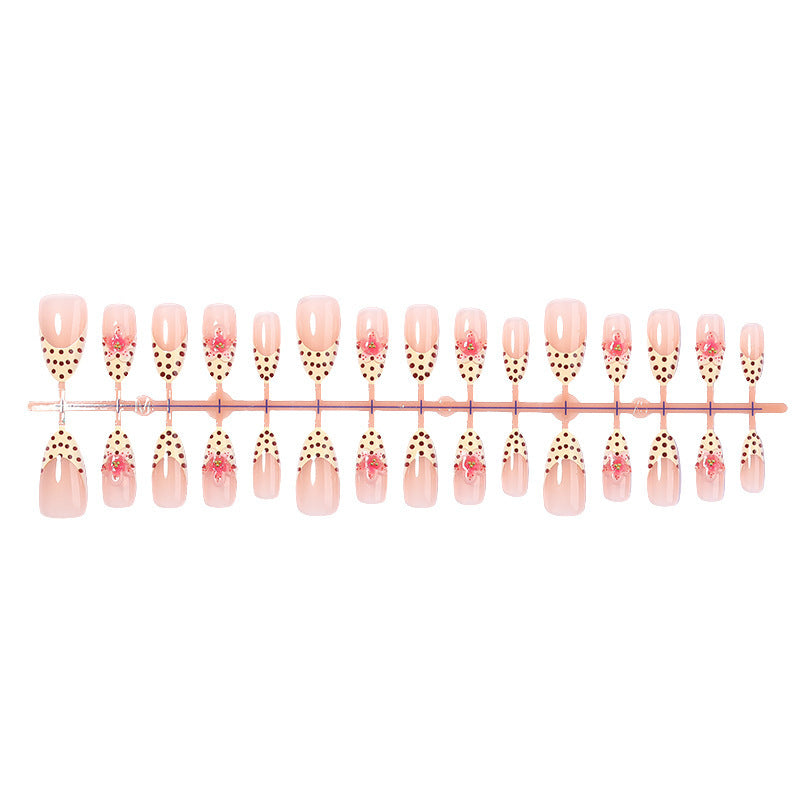 Acrylic nail set with romantic dots and floral accents Bowlift